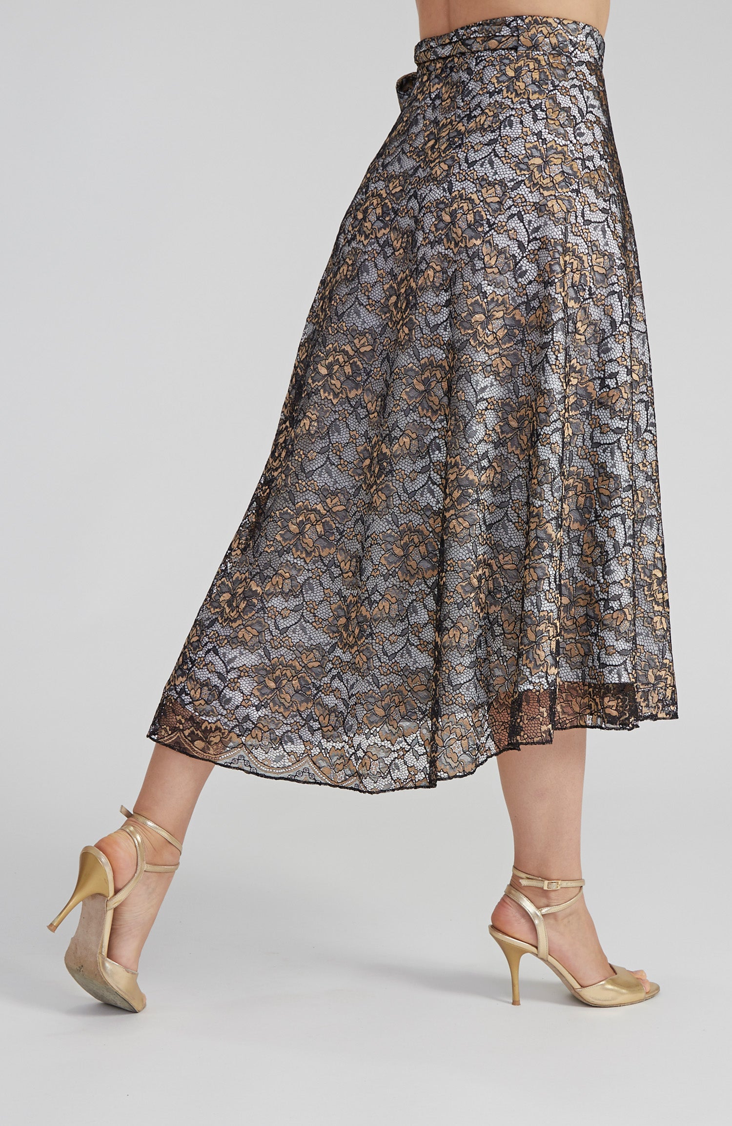 Patterned skirt worn by a person on a plain background