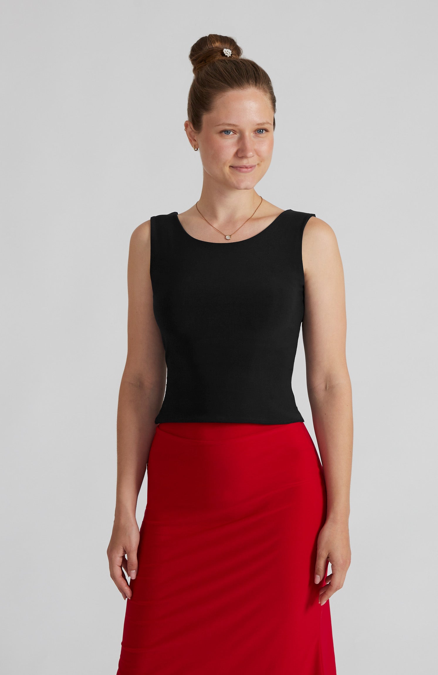 Black cross back top DANIELA with a bateau neckline and open V-back; a double-layered stretch crop top for dance and elegant evening wear.