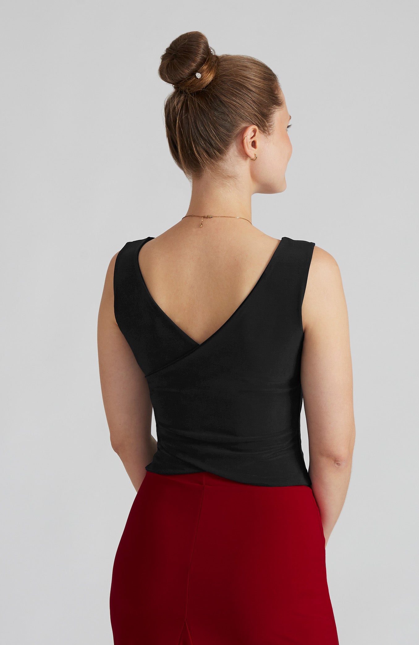 Black cross back top DANIELA with a bateau neckline and open V-back; a double-layered stretch crop top for dance and elegant evening wear.