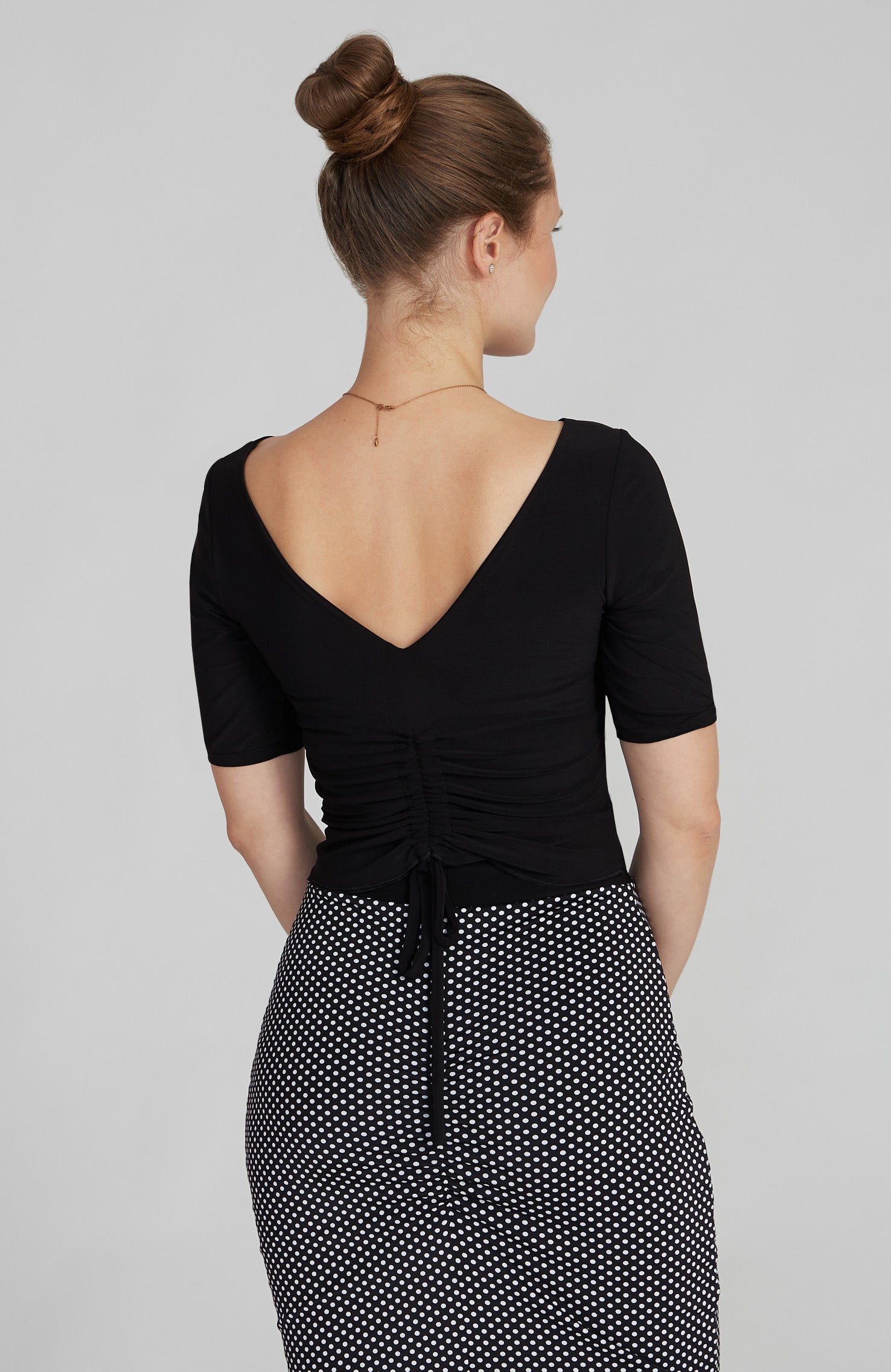 Black draped tango top DOROTEA with elegant neckline and fluid fit.