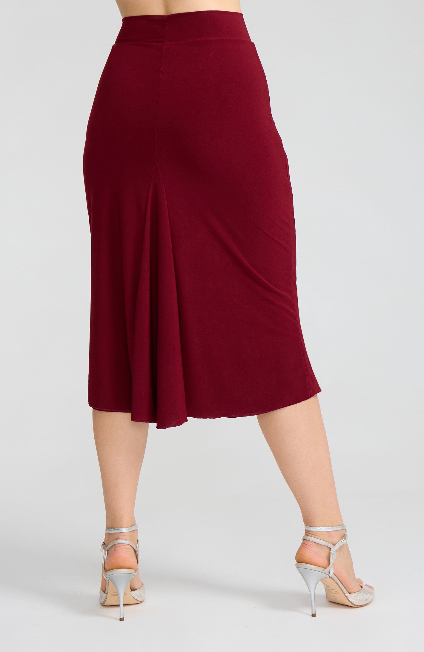 Model wearing the JAZMIN bordeaux red godet tango skirt on the dance floor.