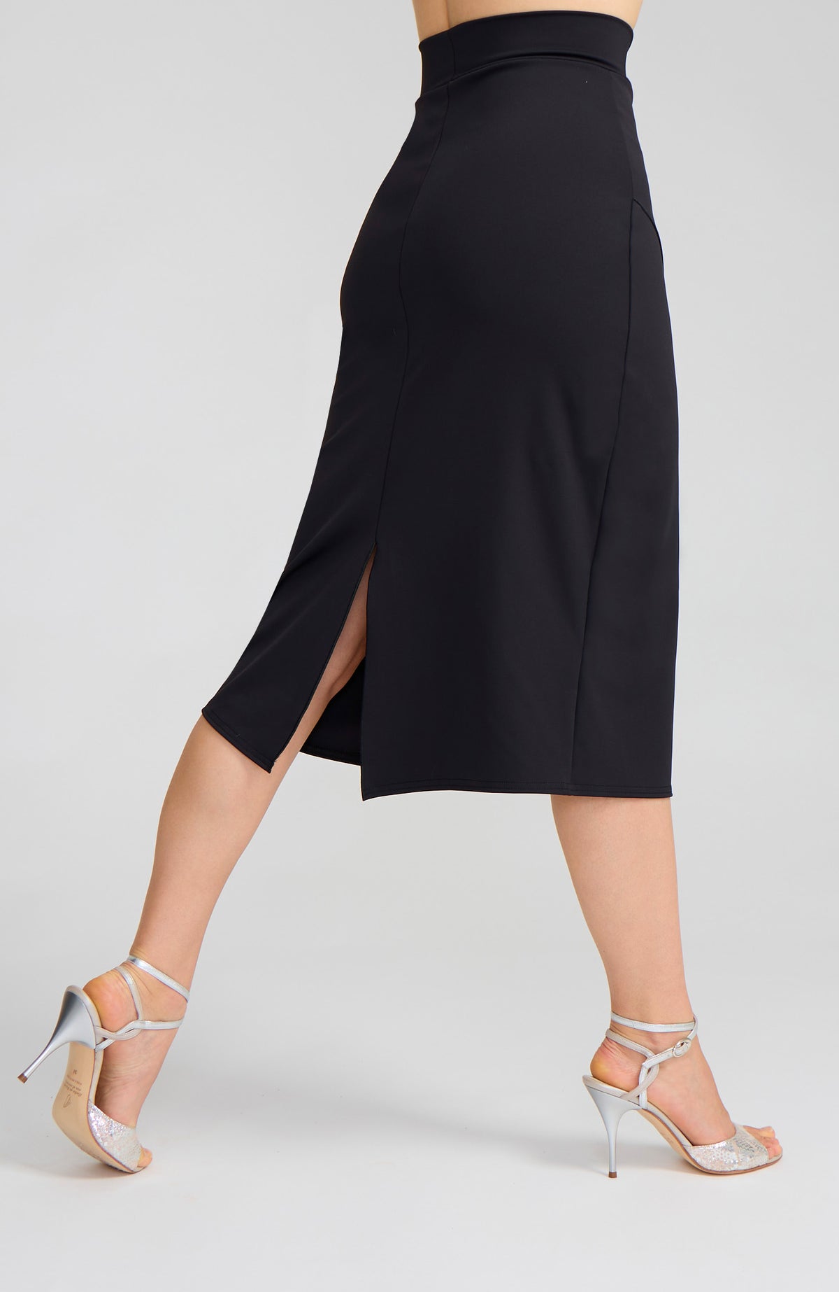 Model wearing the VALERY charcoal black overlap tango skirt on the dance floor.