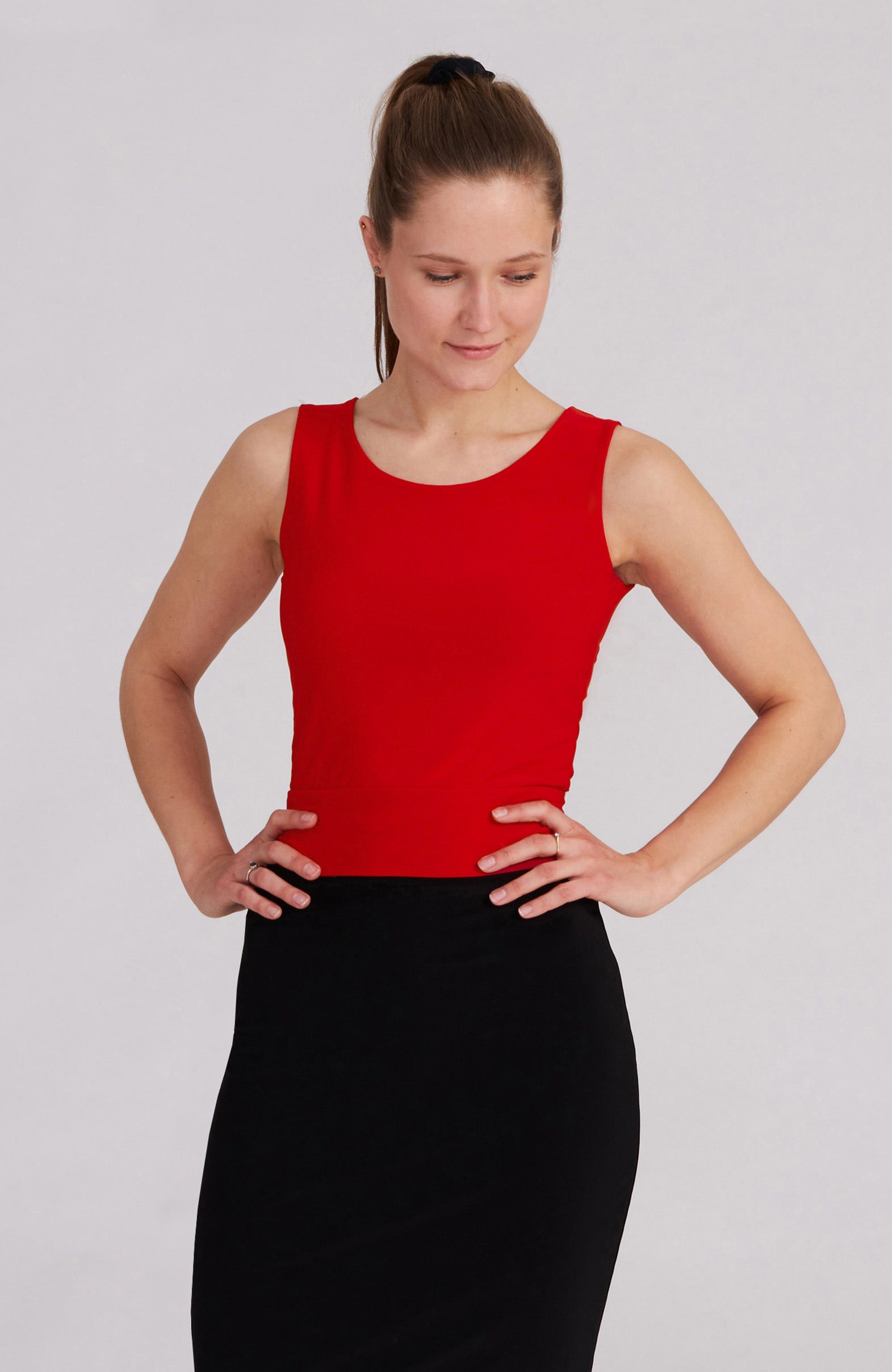 Model wearing the ZOE red tango top with beateau neckline.
