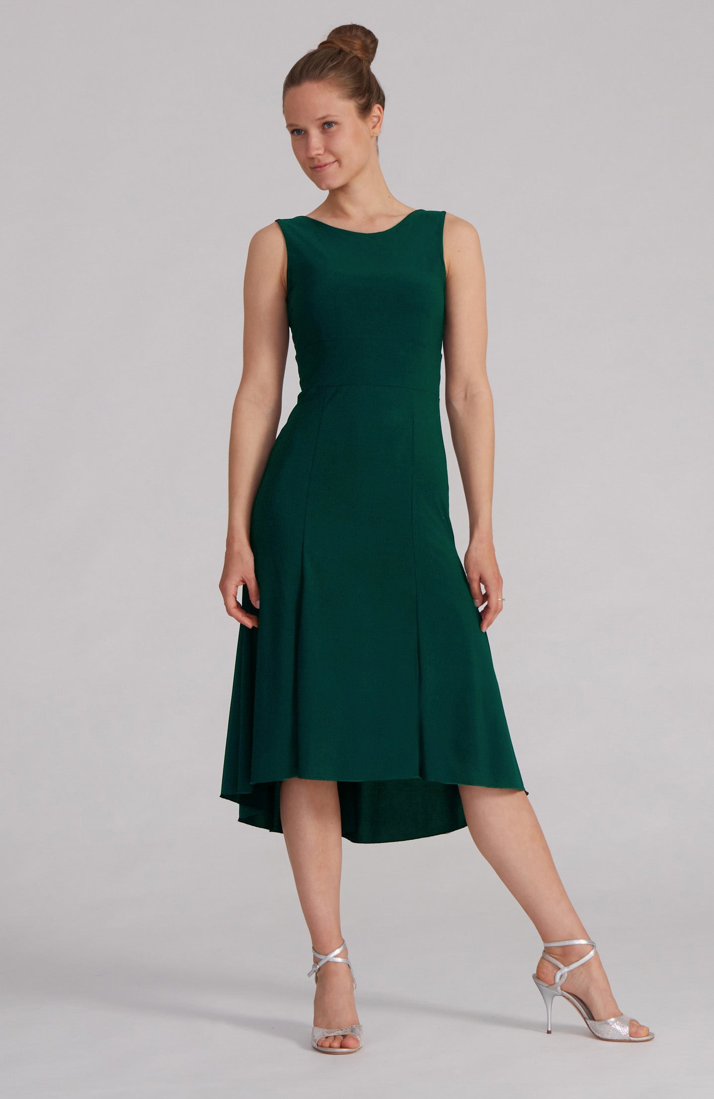 Green A-line Argentine tango dress CARLA with a bateau neckline and flowing high-low hem.