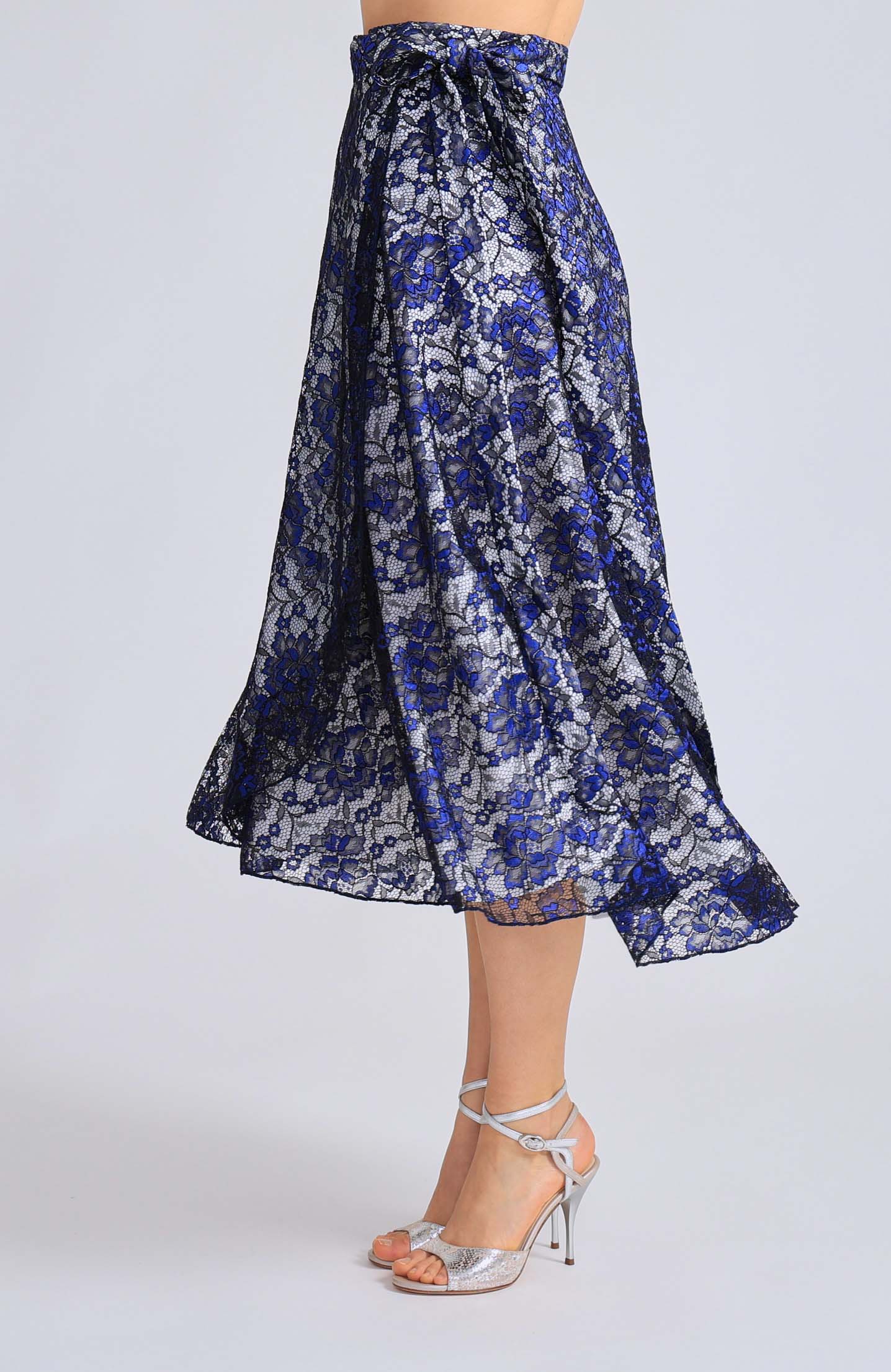 Long blue lace wrap skirt GINA with a soft white lining and an adjustable tie waist, showcasing an elegant flowing silhouette for tango dancing.