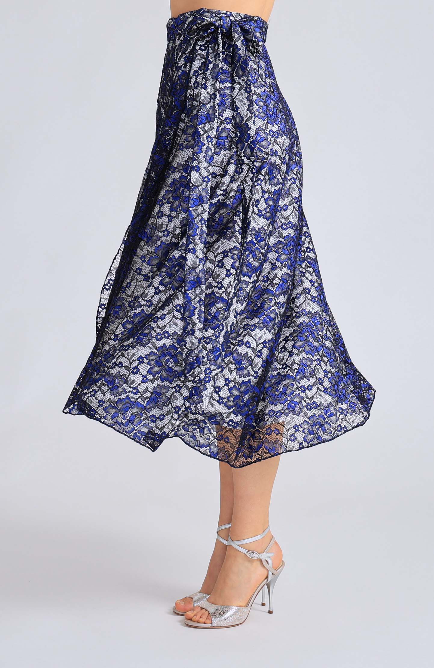 Long blue lace wrap skirt GINA with a soft white lining and an adjustable tie waist, showcasing an elegant flowing silhouette for tango dancing.