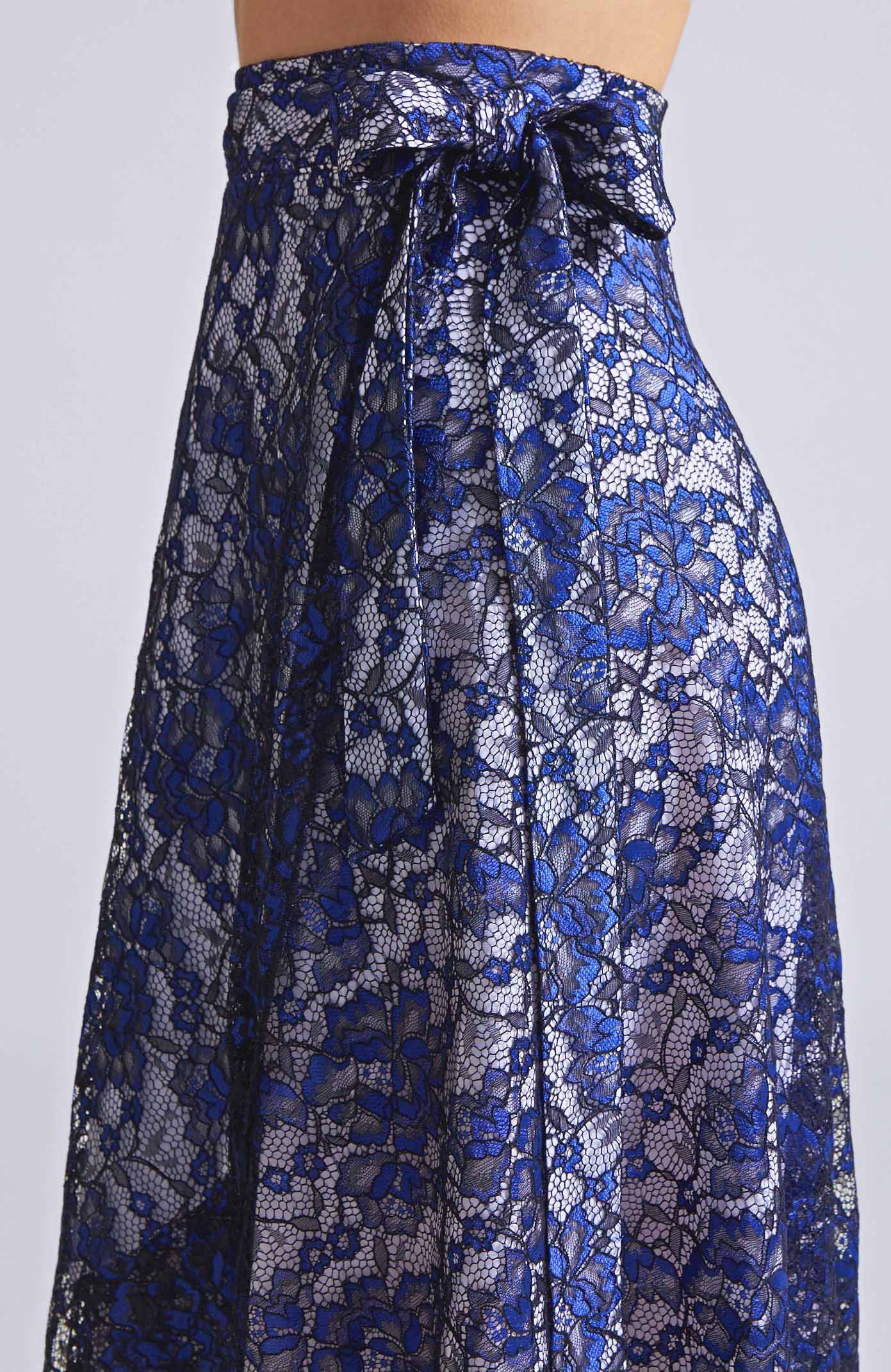 Close-up of the adjustable waist tie on the GINA long wrap tango skirt in blue lace fabric.
