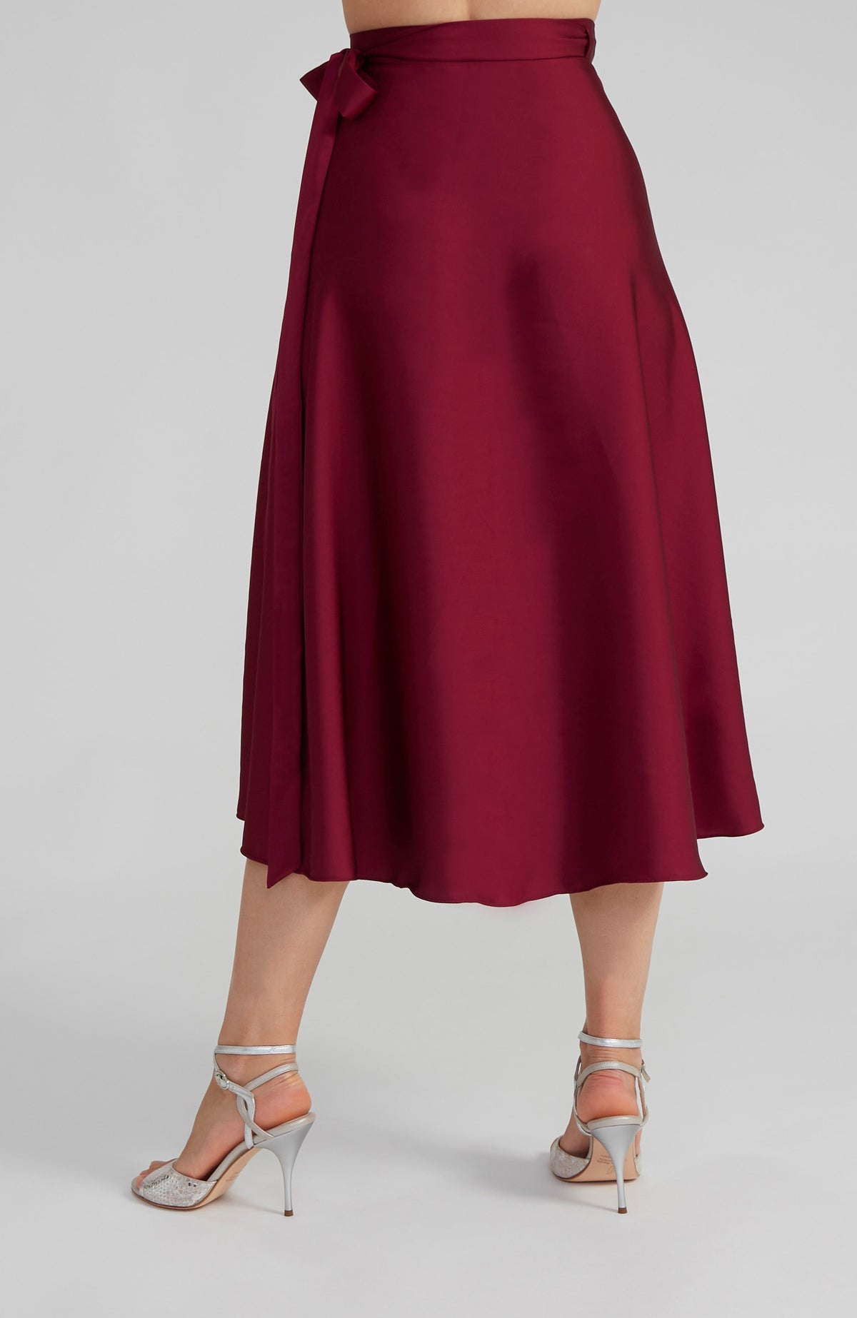 Long Bordeaux red satin wrap skirt GINA with a side-tie waist; an elegant Argentine tango skirt designed for a flowing, elongated silhouette.