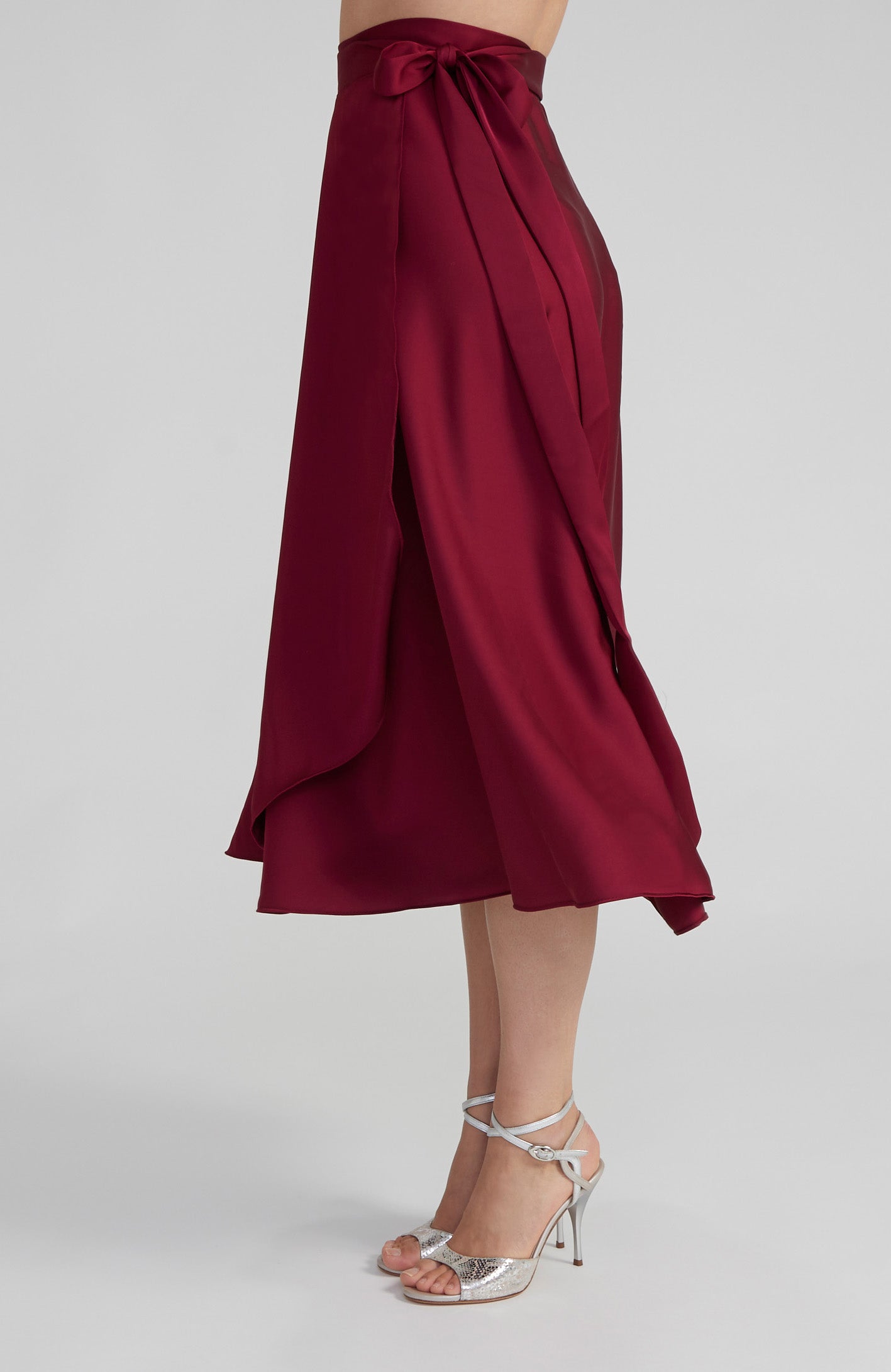 Long Bordeaux red satin wrap skirt GINA with a side-tie waist; an elegant Argentine tango skirt designed for a flowing, elongated silhouette.