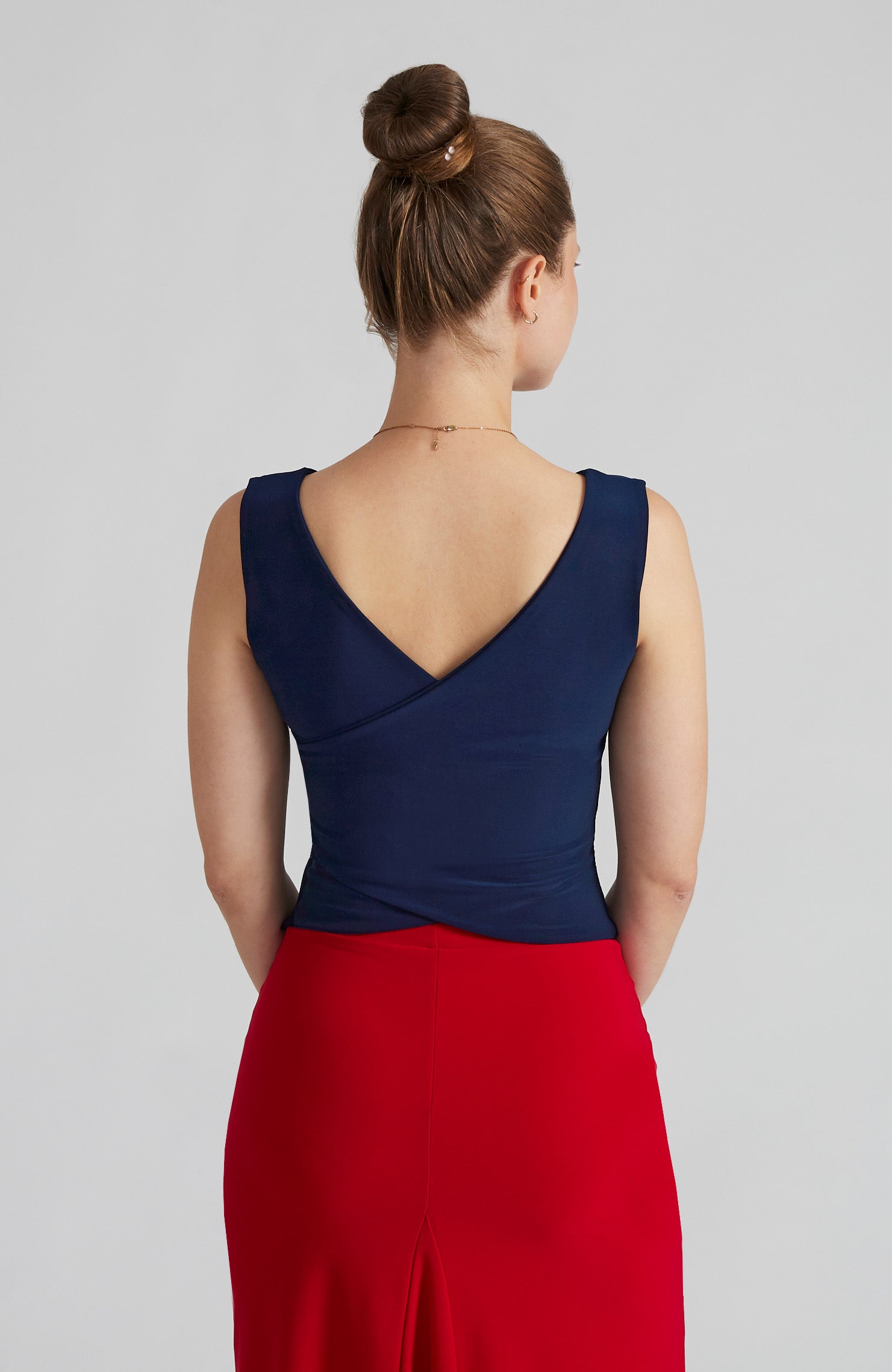 Navy blue cross back top DANIELA with a bateau neckline and open V-back; a double-layered stretch crop top for dance and evening wear.