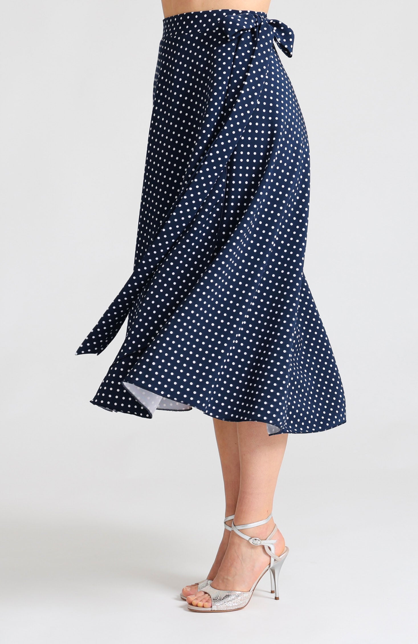 Long wrap tango skirt in navy blue with white polka dots with bow.