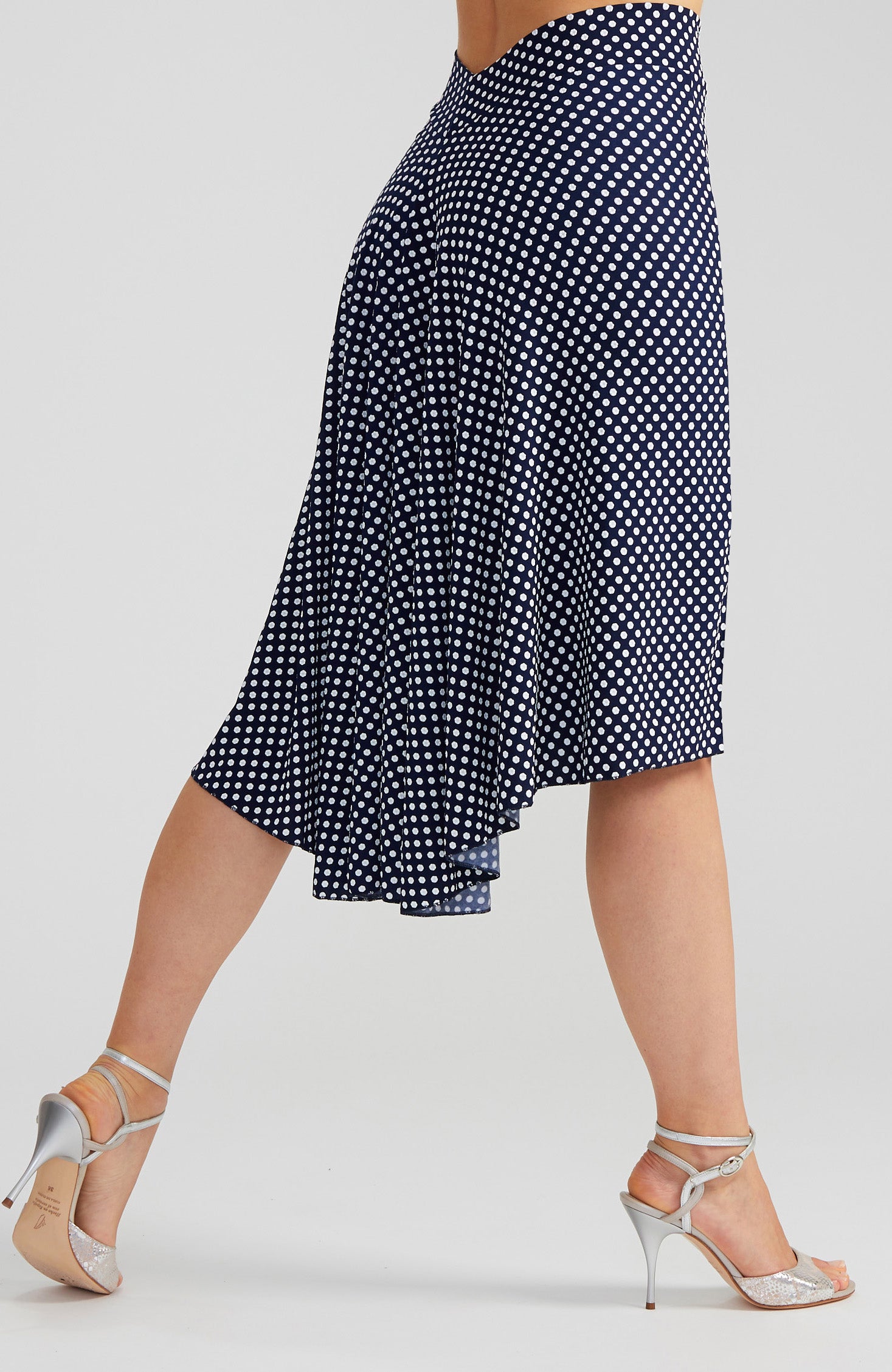 Navy blue and white polka dot tango skirt PAOLA with a front slit and fishtail back; a slim-fit stretch dance skirt with a dramatic high-low silhouette.