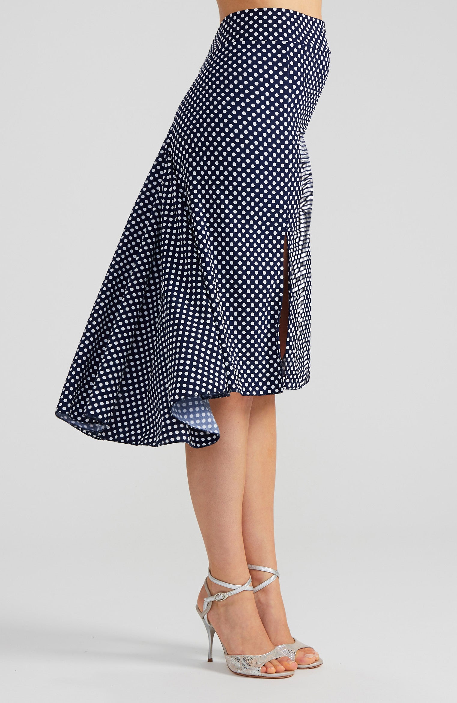Navy blue and white polka dot tango skirt PAOLA with a front slit and fishtail back; a slim-fit stretch dance skirt with a dramatic high-low silhouette.
