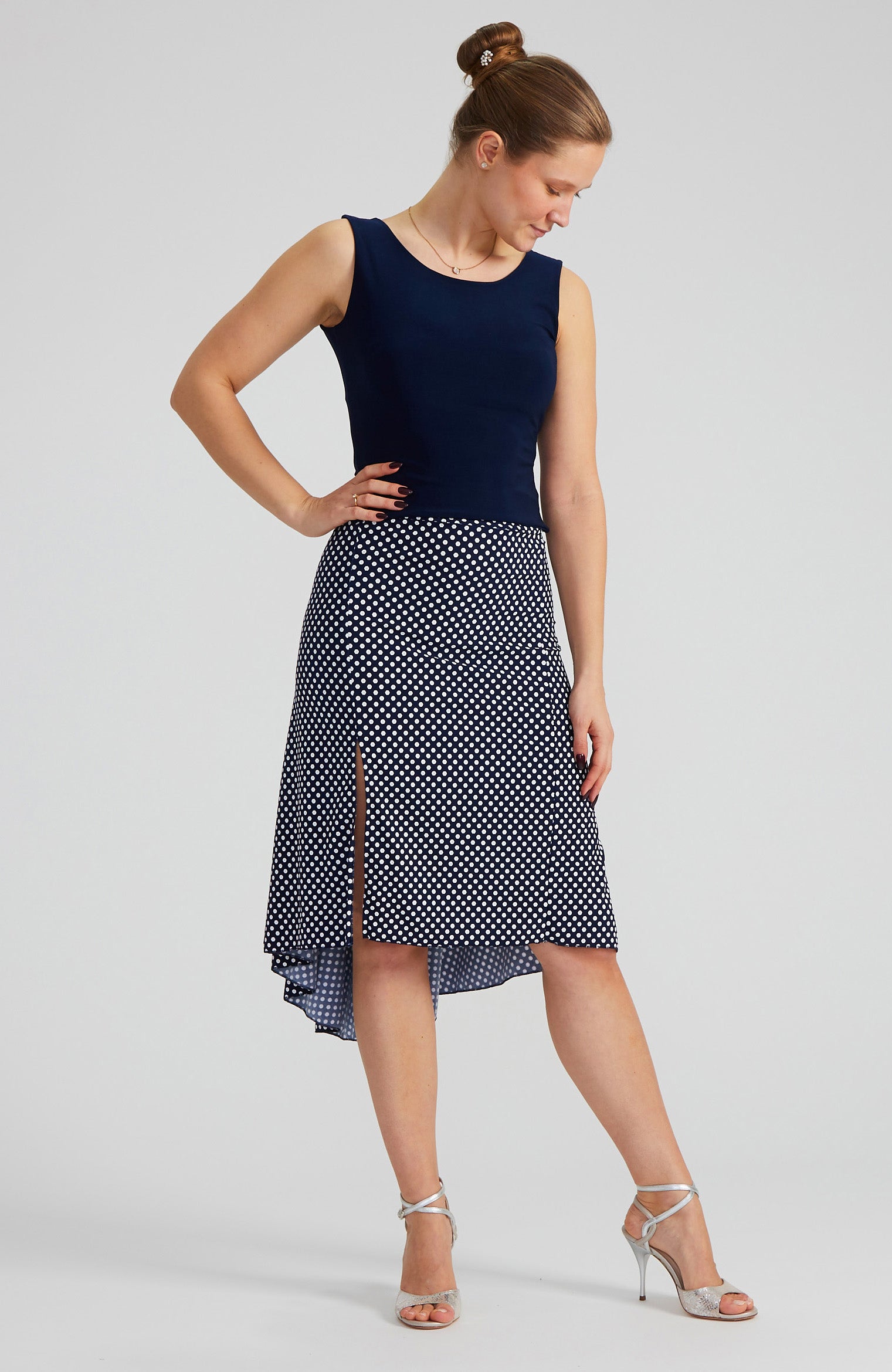 Navy blue and white polka dot tango skirt PAOLA with a front slit and fishtail back; a slim-fit stretch dance skirt with a dramatic high-low silhouette.