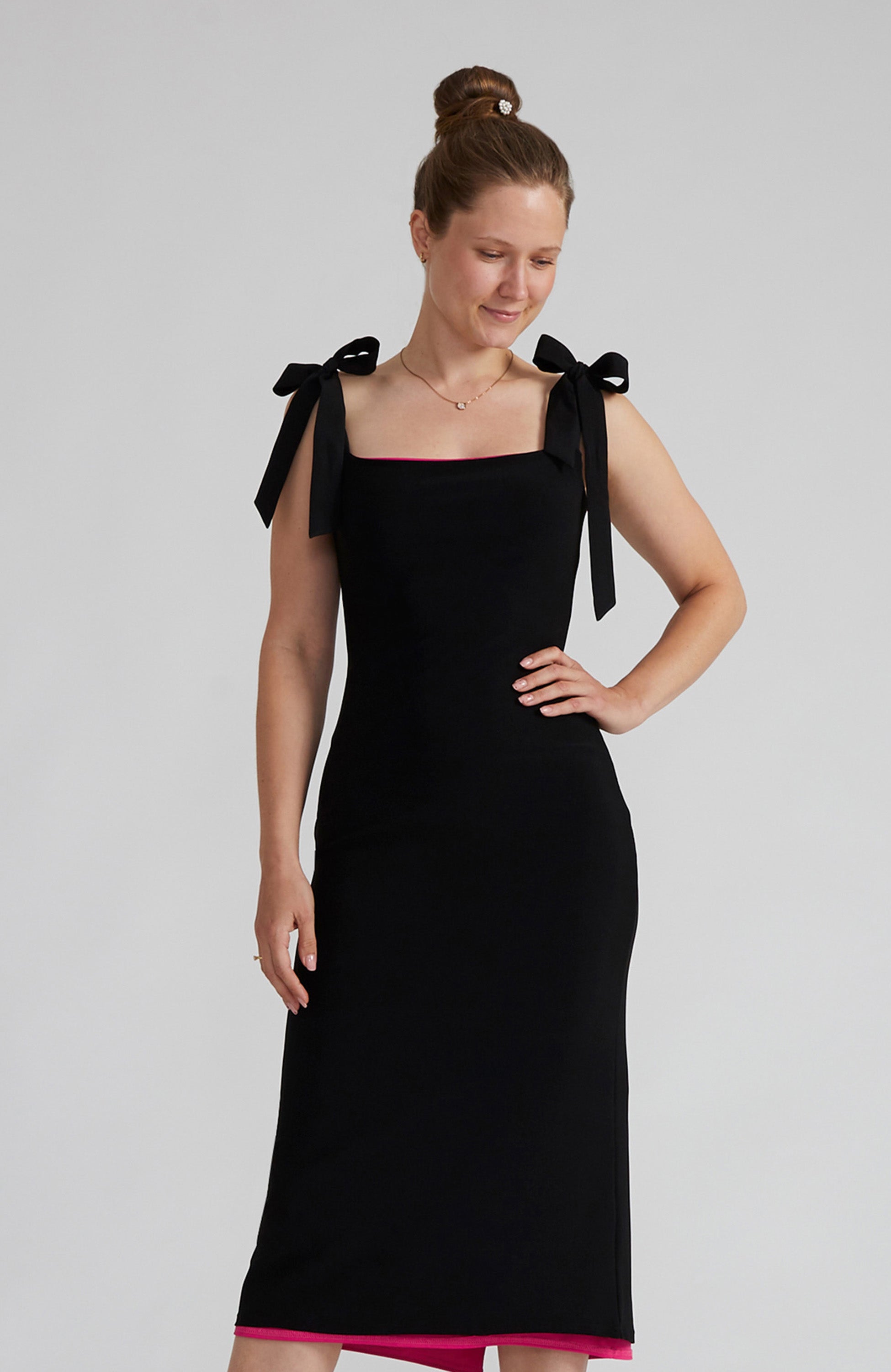 Reversible black tango dress with a bow detail.