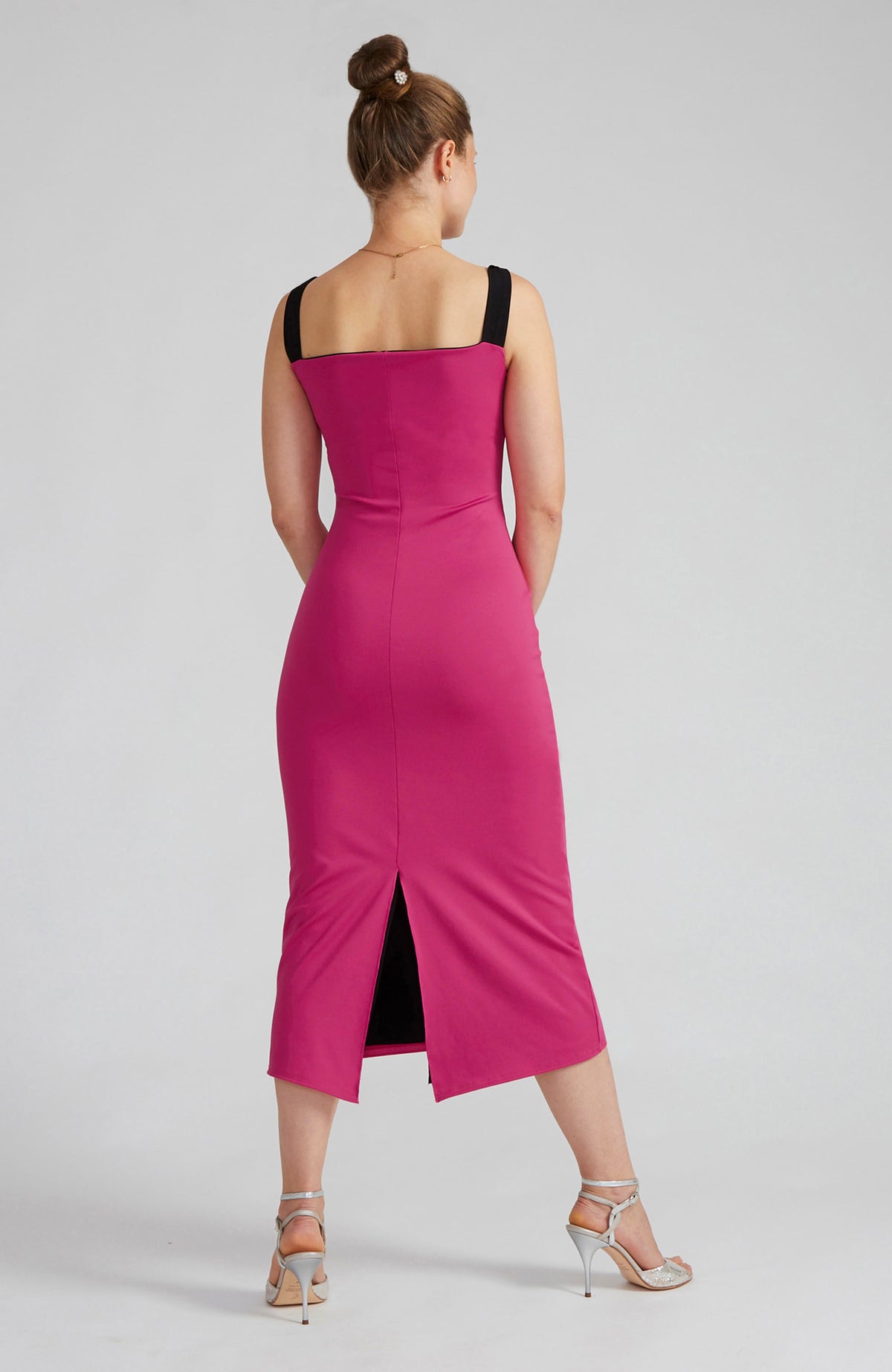 Reversible black and fuchsia tango dress with a bow detail.