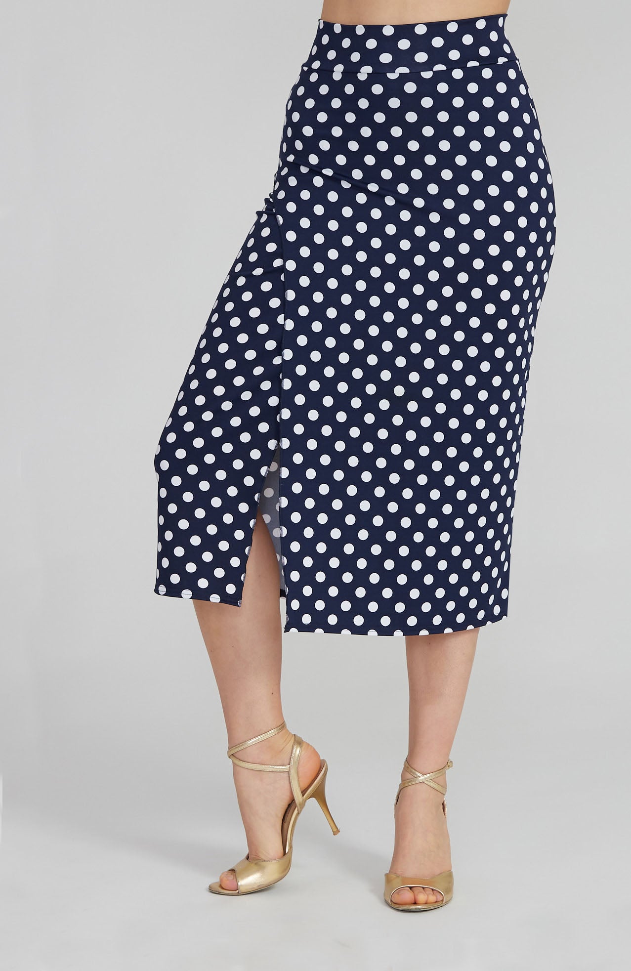Model wearing the VALERY polka dot tango skirt with a front overlap and back slit, showcasing its fit and elegant movement.