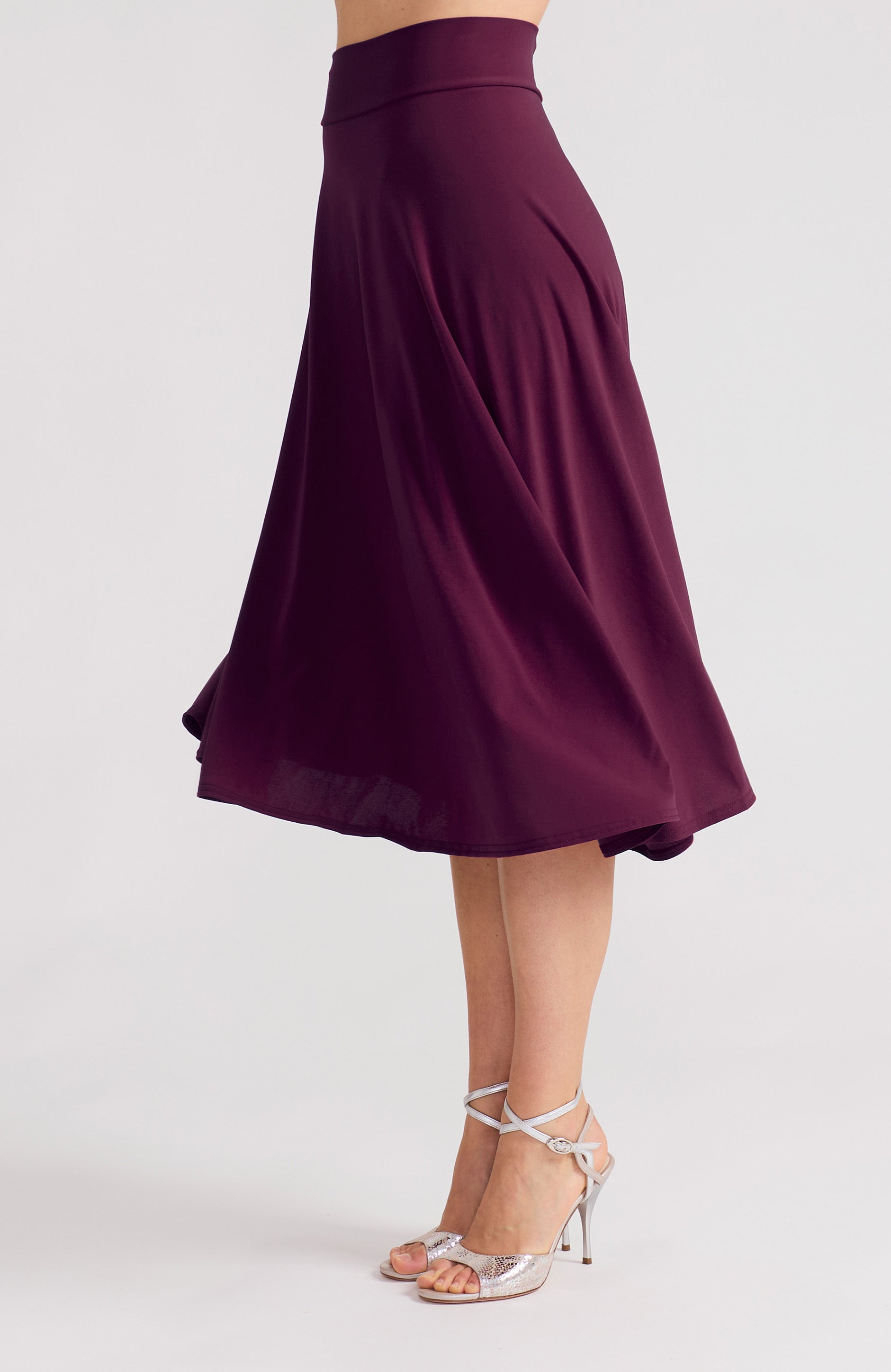 Violet A-line tango skirt AUDREY with a flowing high-low hem in a solid purple tone.