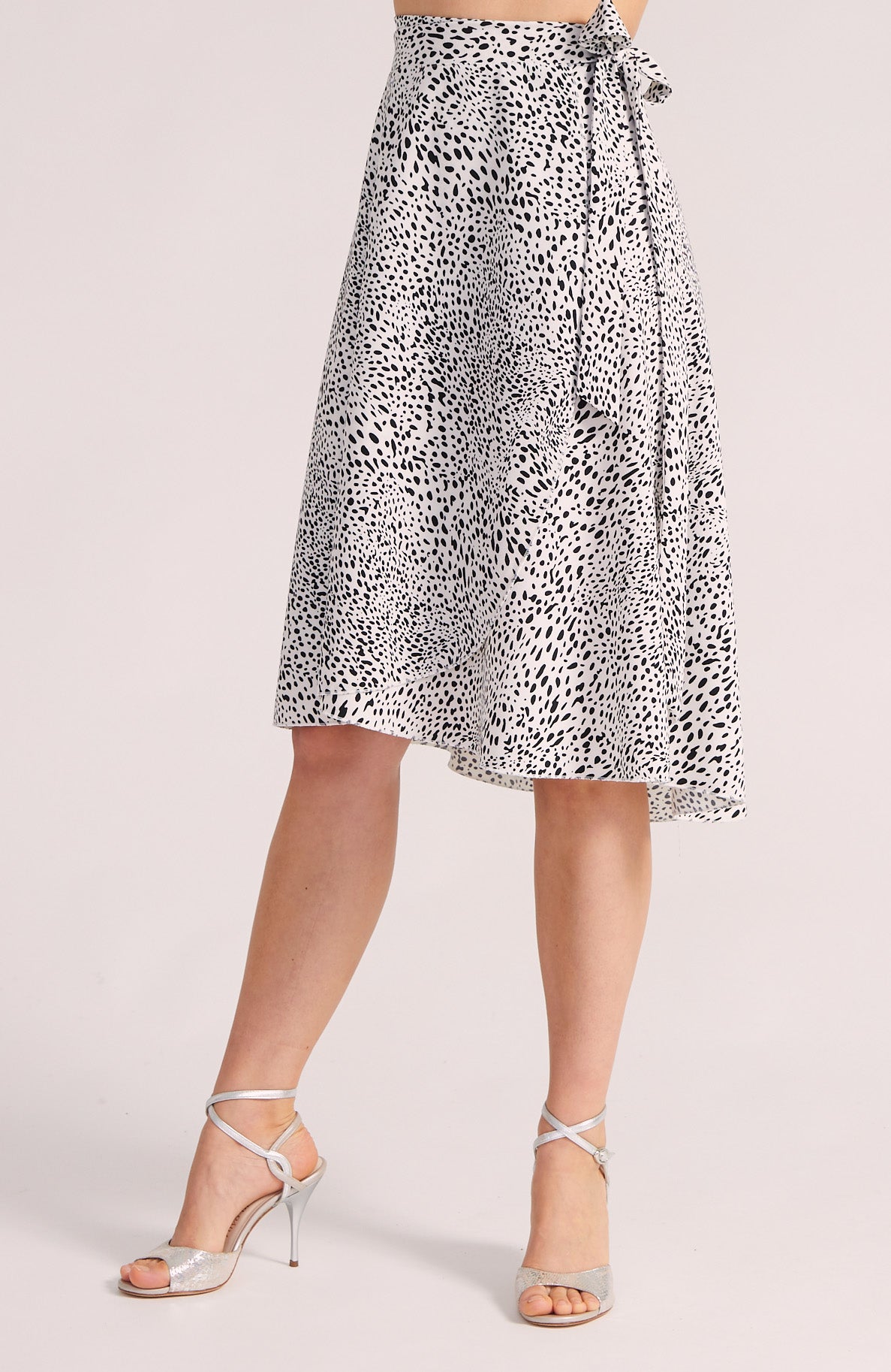 Animal print skirt worn by a person on a light gray background