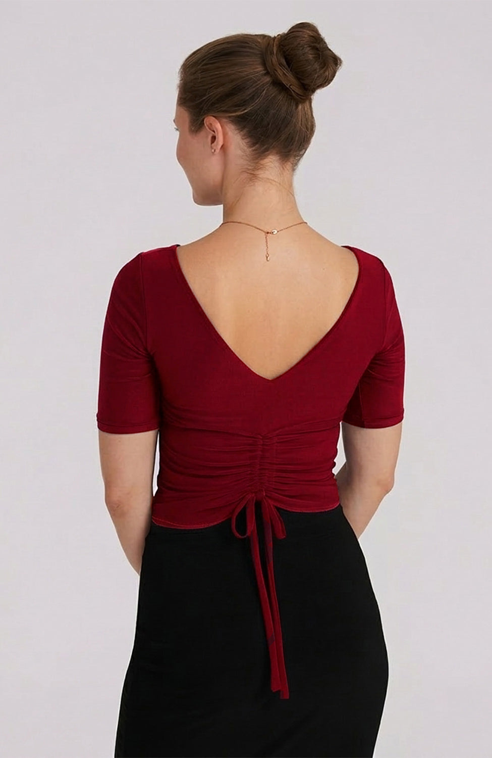 Detail of the adjustable draped back and ties on the bordeaux red DOROTEA tango top for a custom fit