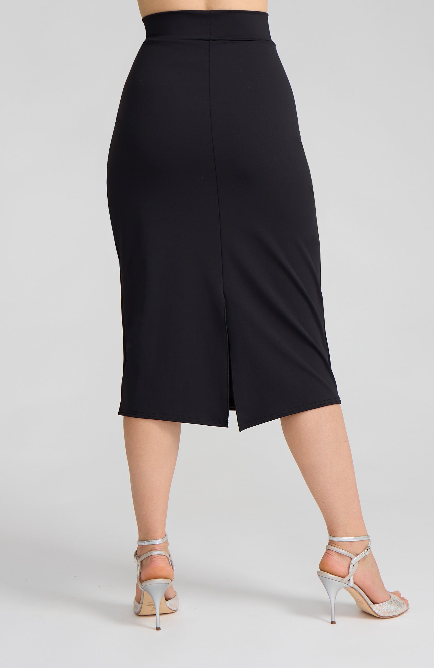Model wearing the VALERY charcoal black overlap tango skirt on the dance floor.