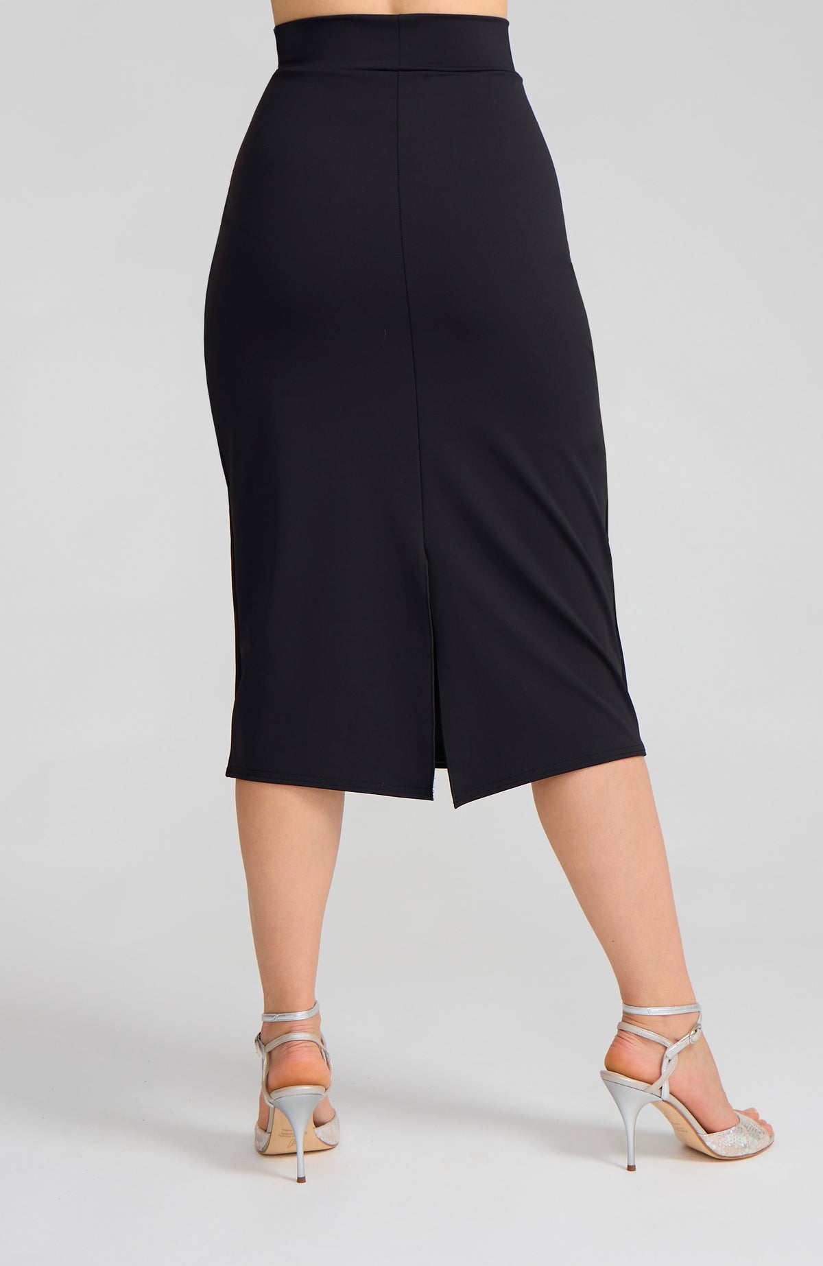 Model wearing the VALERY charcoal black overlap tango skirt on the dance floor.