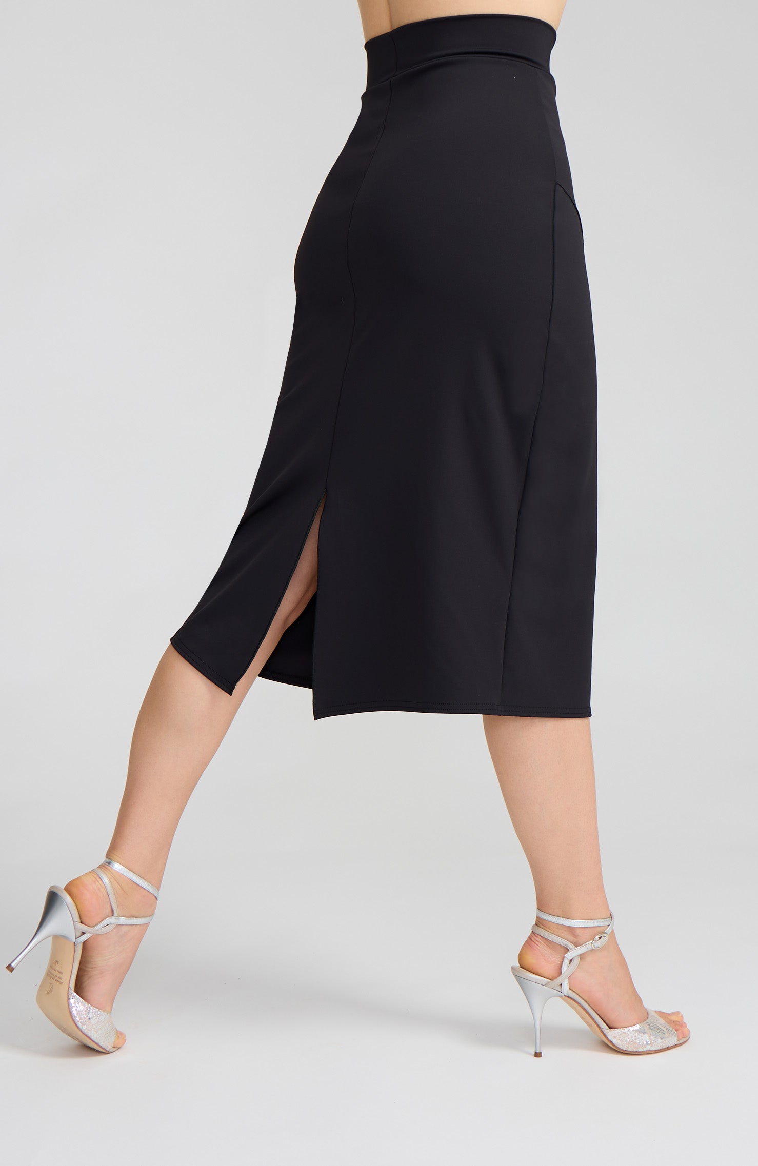 Model wearing the VALERY charcoal black overlap tango skirt on the dance floor.