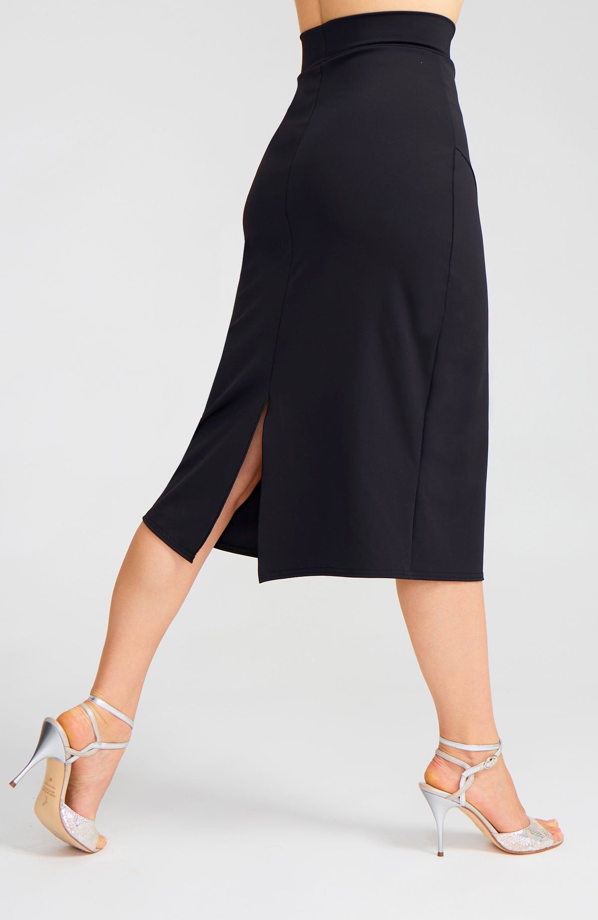 Model wearing the VALERY charcoal black overlap tango skirt on the dance floor.
