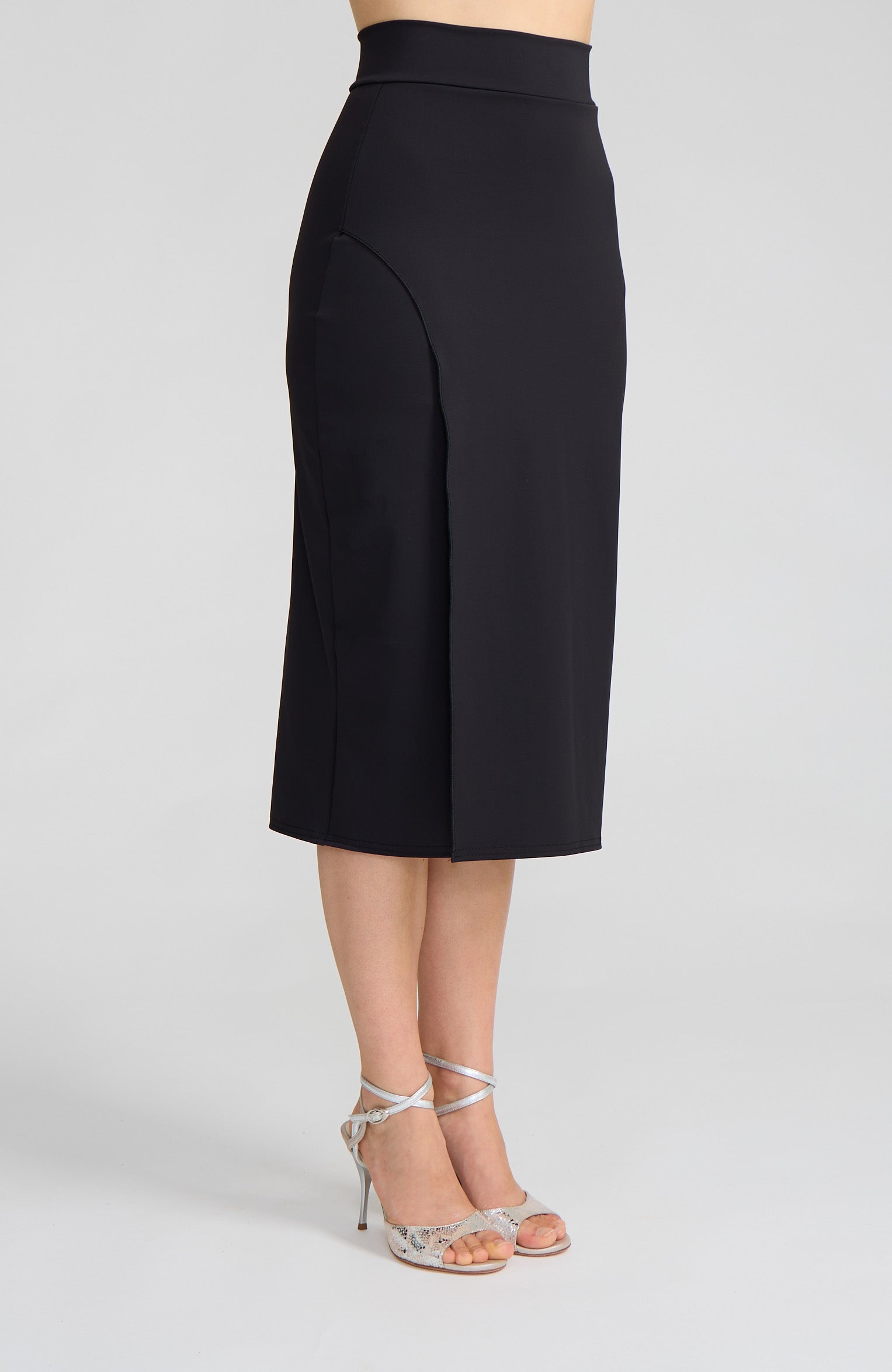 Model wearing the VALERY charcoal black overlap tango skirt on the dance floor.