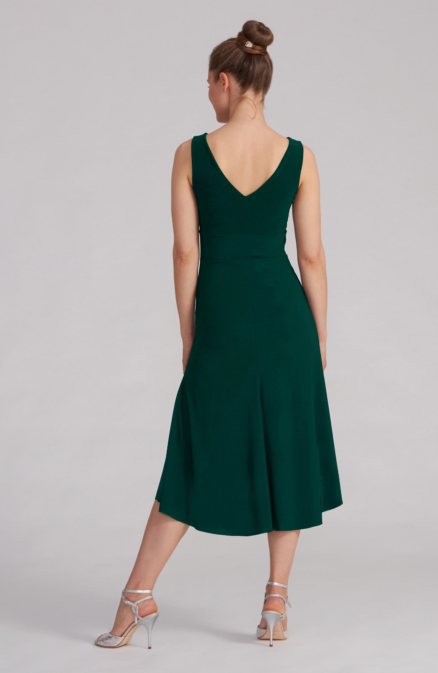 Green A-line Argentine tango dress CARLA with a bateau neckline and flowing high-low hem.
