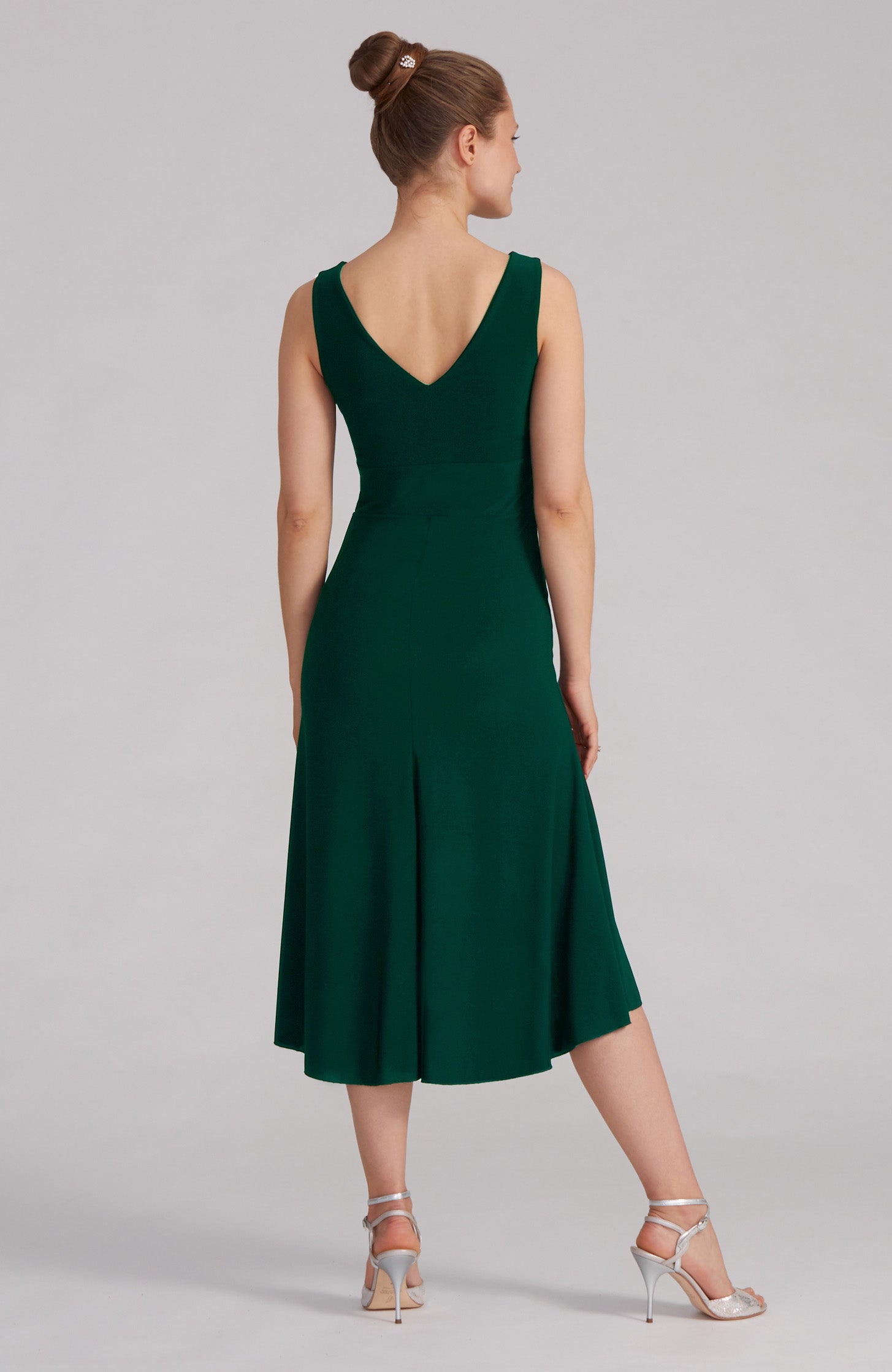 Green A-line Argentine tango dress CARLA with a bateau neckline and flowing high-low hem.