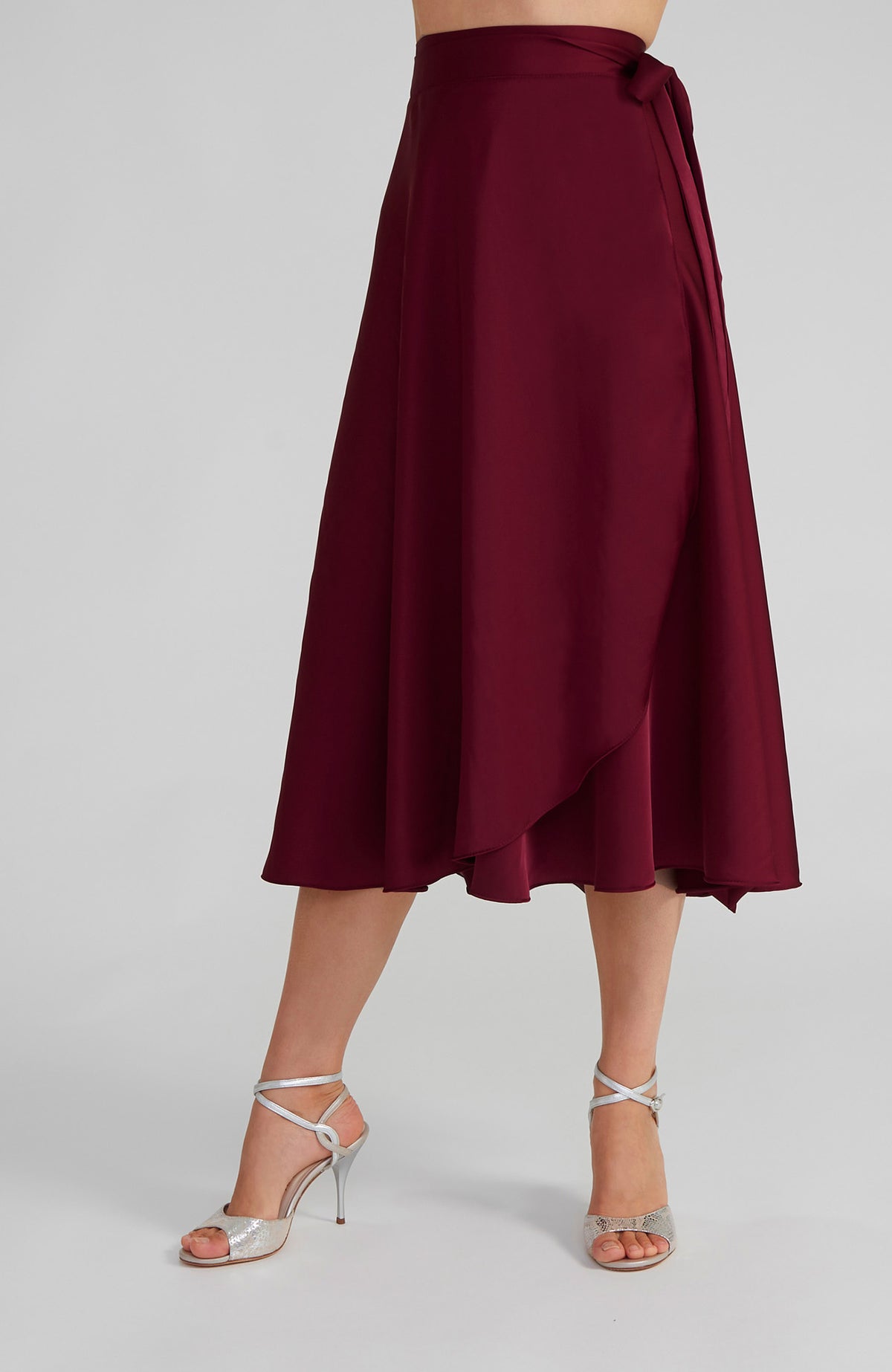 Long Bordeaux red satin wrap skirt GINA with a side-tie waist; an elegant Argentine tango skirt designed for a flowing, elongated silhouette.