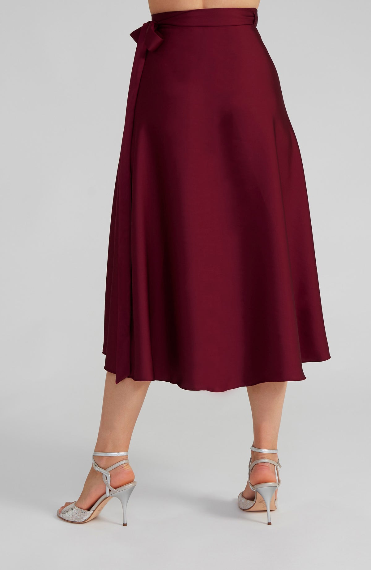 Long Bordeaux red satin wrap skirt GINA with a side-tie waist; an elegant Argentine tango skirt designed for a flowing, elongated silhouette.