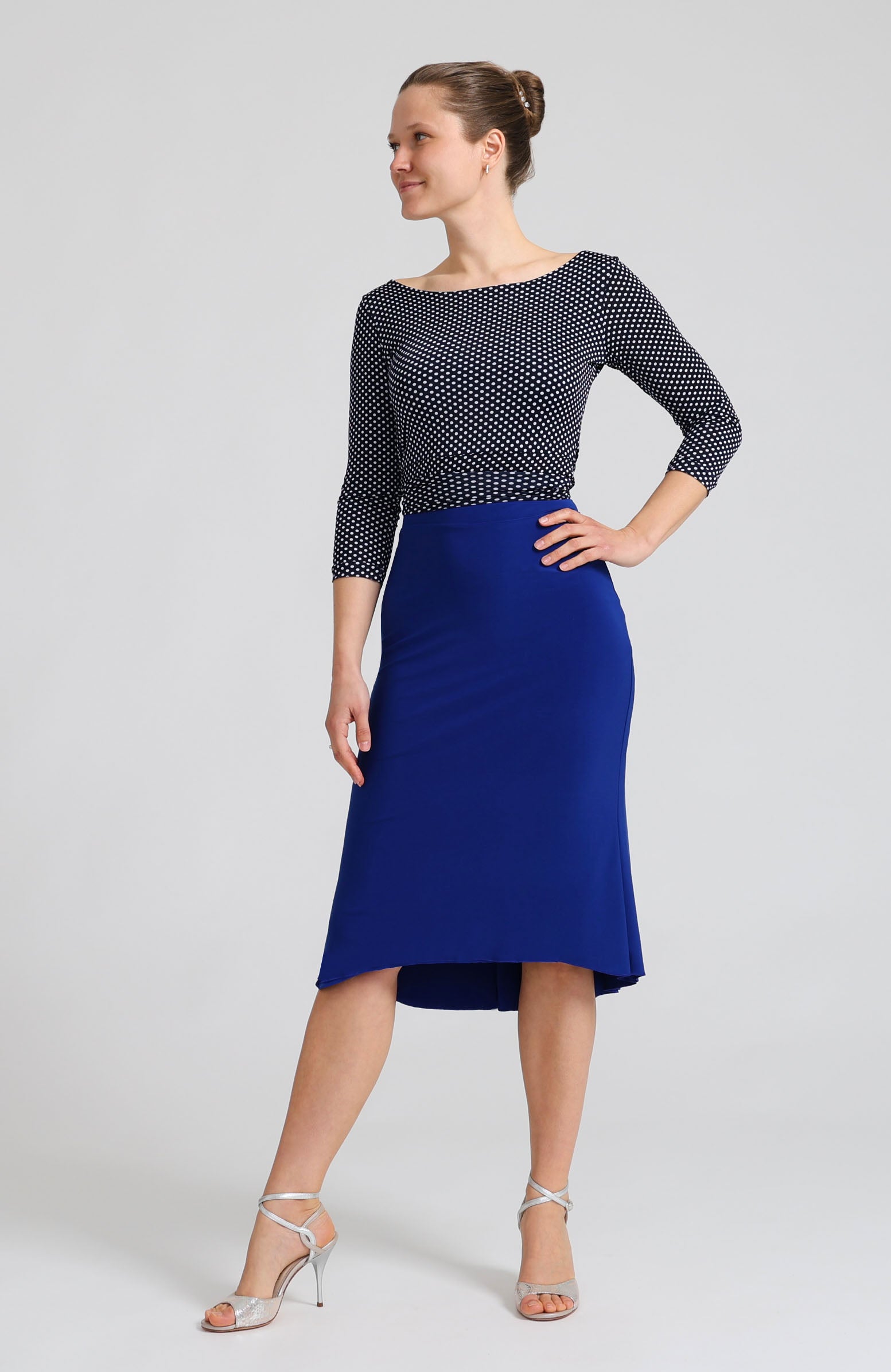 Navy blue polka dot wrap top ELLA with sleeves, featuring a bateau neckline paired with a royal blue tango skirt.