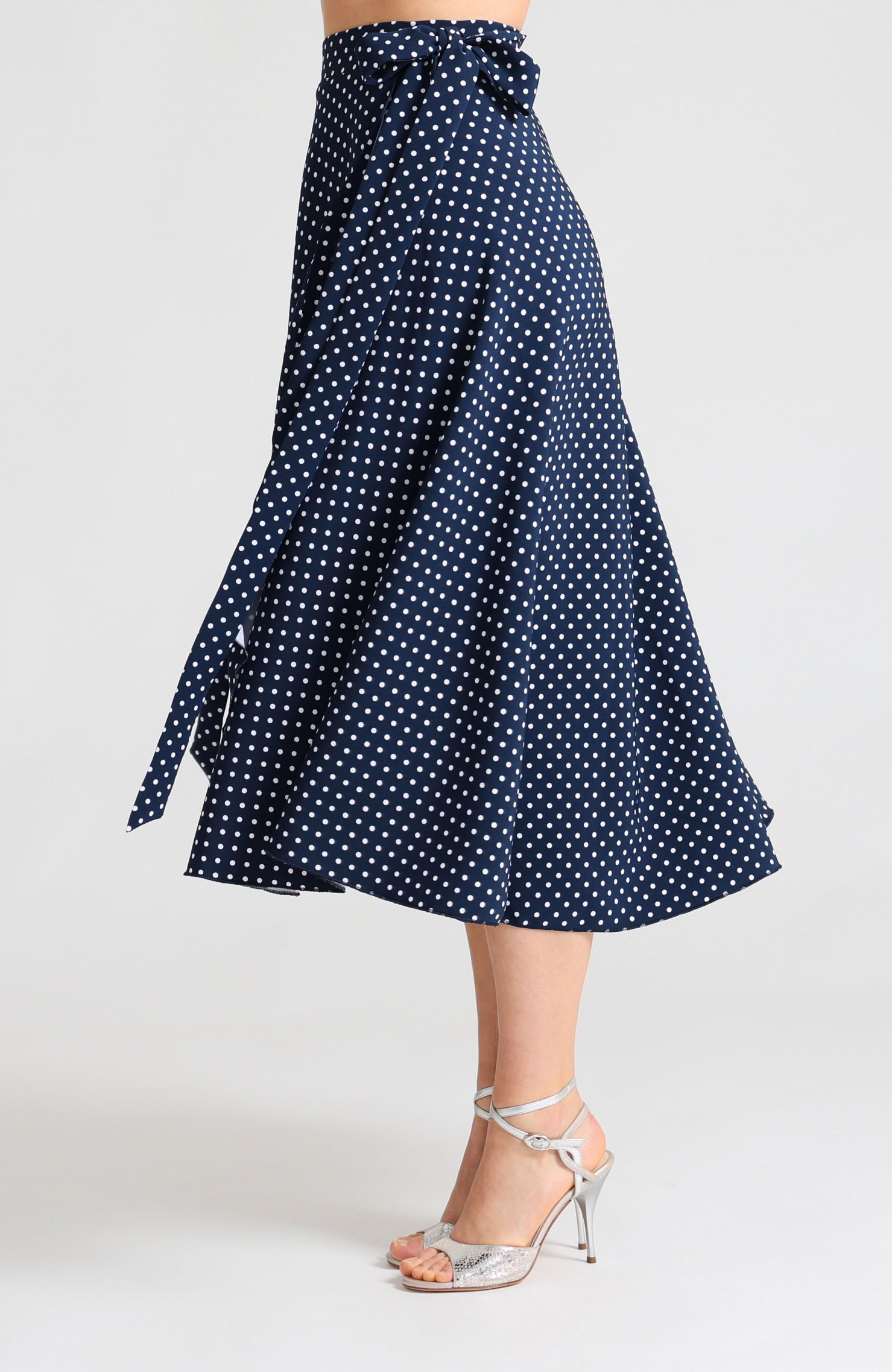 Long Wrap Tango Skirt in navy blue with white polka dots and bow.