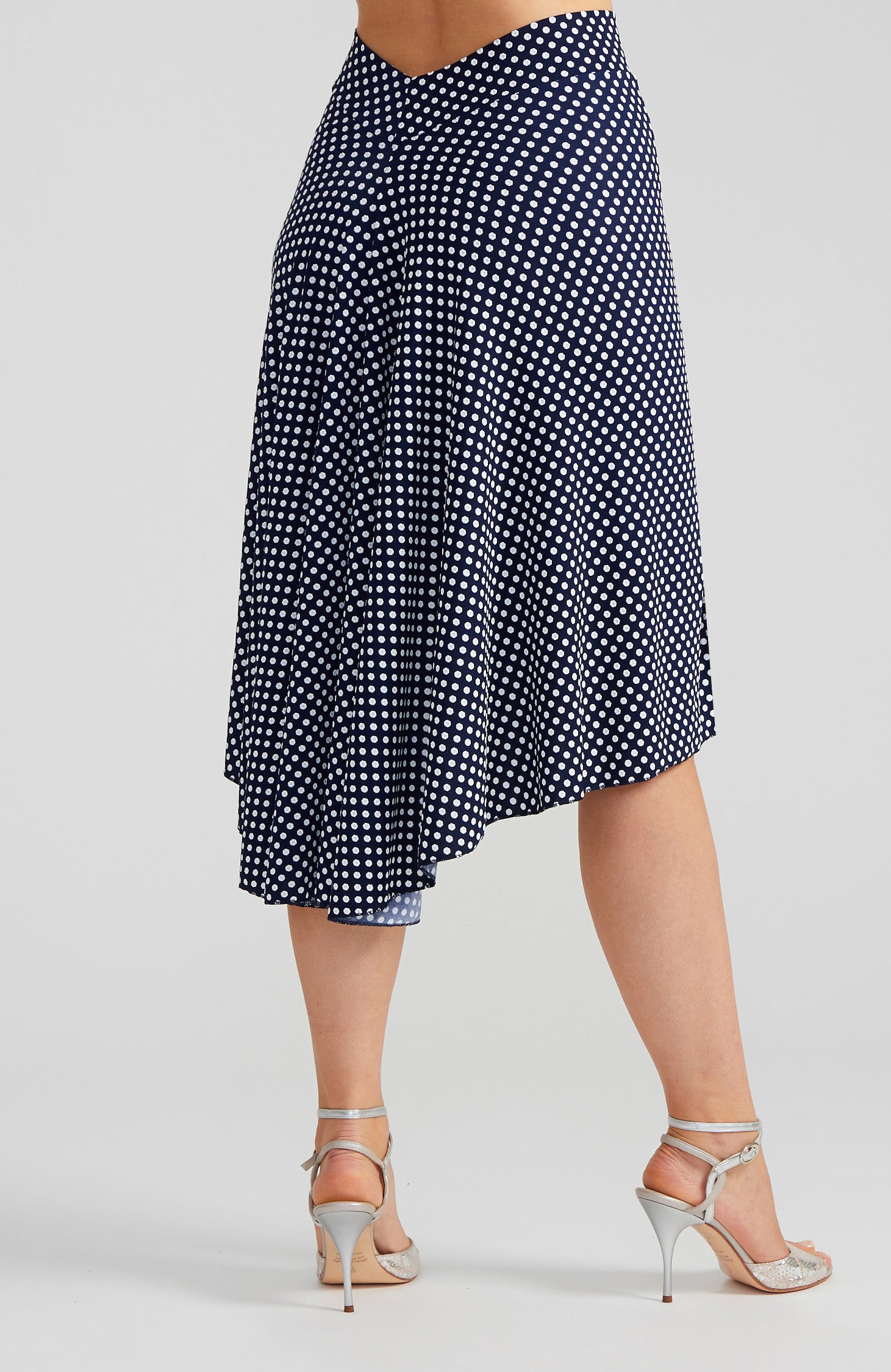 Navy blue and white polka dot tango skirt PAOLA with a front slit and fishtail back; a slim-fit stretch dance skirt with a dramatic high-low silhouette.