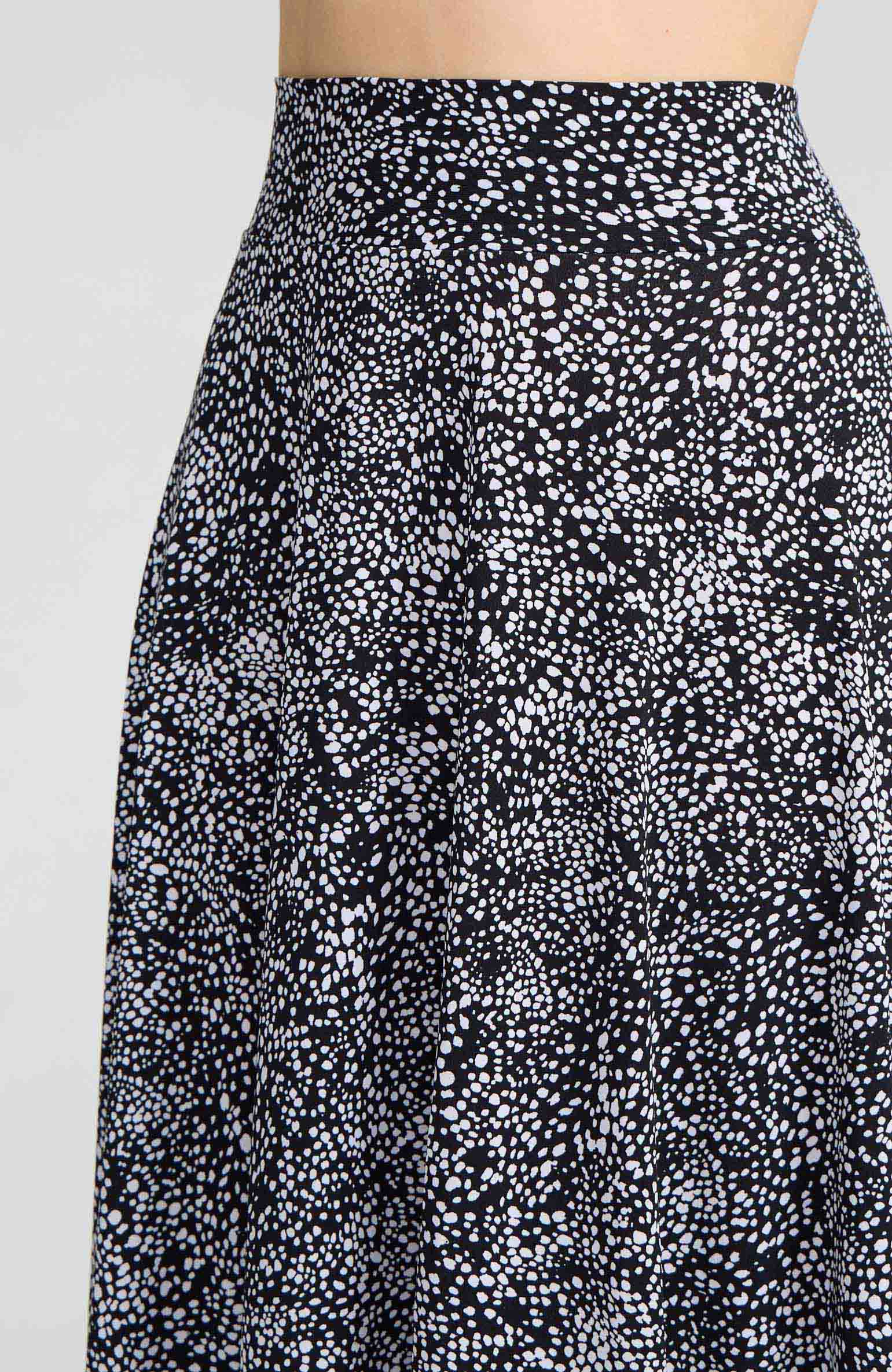 Model wearing the AUDREY black and white polka dot A-line tango skirt.