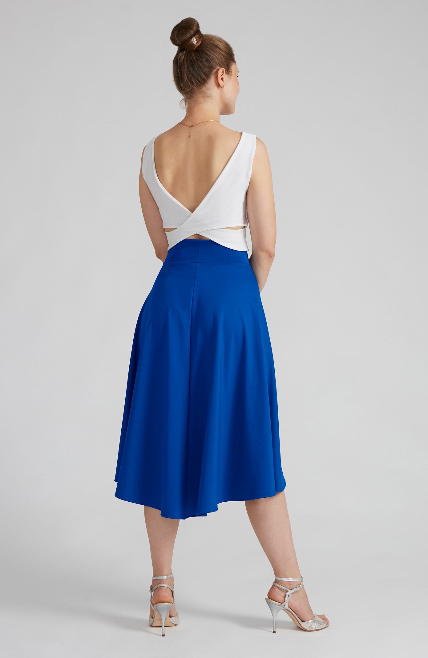 Royal blue A-line Argentine tango skirt paired with a white cross back top.