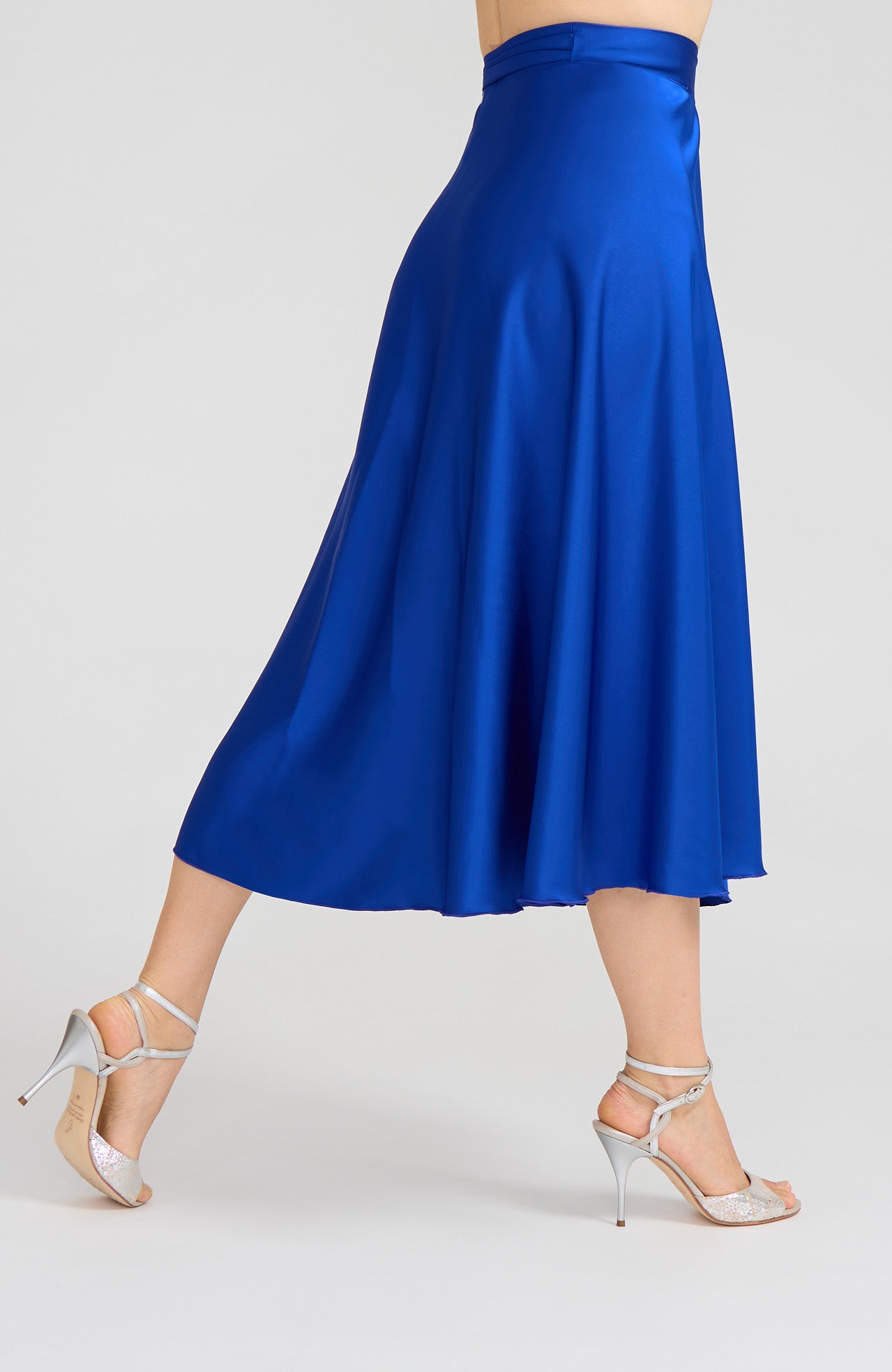 Model wearing the GINA royal blue satin tango wrap skirt on the dance floor.